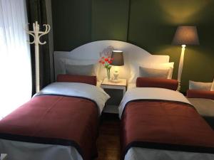 Postel nebo postele na pokoji v ubytování Hotel Taksim Home