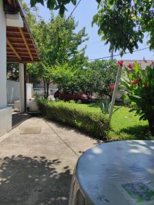 a house with a car parked in a yard at Villa 17 in Gevgelija