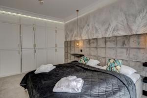 Posteľ alebo postele v izbe v ubytovaní MALAGA APARTAMENTY BALTICUS