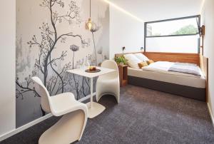 เตียงในห้องที่ TIN INN Montabaur l einfach gut - Das Hotel aus hochwertig ausgebauten Überseecontainern