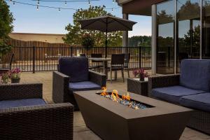 a patio with two chairs and a fire pit at Wyndham Avon in Avon Center