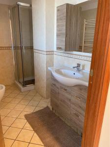a bathroom with a sink and a shower at Casa di Antonia in San Marzano sul Sarno +10 photos