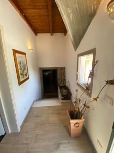 a hallway of a house with a brick fireplace at Taverna Bucciante in Fossacesia