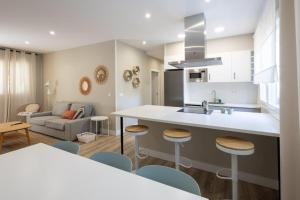 Kuchyň nebo kuchyňský kout v ubytování Miño Suites I + 15 fotografií