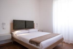 Voodi või voodid majutusasutuse Nautika Suites toas