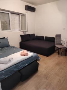 a living room with a bed and a couch at Villa 17 in Gevgelija