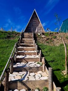 a set of stairs leading up to a cabin at Mountain cottage Captain's Lake, Kapetanovo jezero in Kolašin