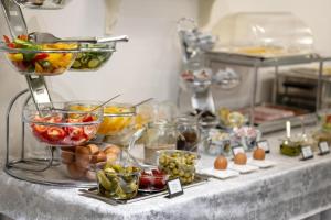 a buffet with many different types of food on a table at Elisabeth Old Town in Bratislava