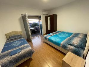 Postel nebo postele na pokoji v ubytování Malina apartman