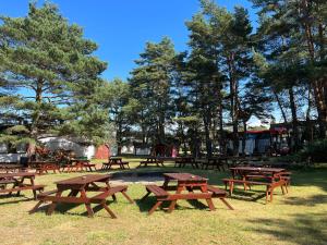 a group of picnic tables in a park at O. W. BRYZA in Rowy