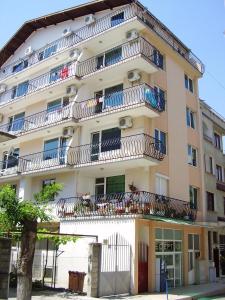 a building with balconies on the side of it at Sea House Guest House in Nesebar