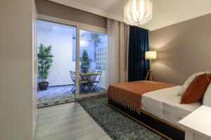 a hotel room with a bed and a balcony at Comfy and Central Flat in the Heart of Sisli in Istanbul