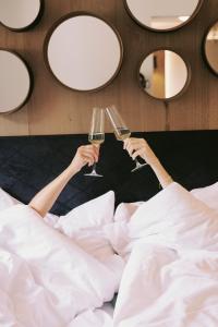 Postel nebo postele na pokoji v ubytování SOULSISTERS' Hotel 4 Sterne Superior