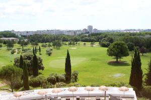a view of a golf course with trees at Hôtel Golf Fontcaude in Montpellier
