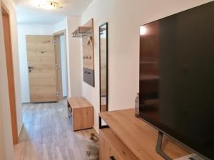 a living room with a large flat screen tv at Zelena Oaza in Zgornja Kungota