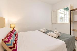 Łóżko lub łóżka w pokoju w obiekcie Casa en el Centro de Sevilla
