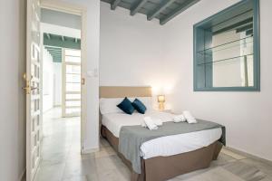 Łóżko lub łóżka w pokoju w obiekcie Casa en el Centro de Sevilla