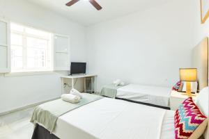 Łóżko lub łóżka w pokoju w obiekcie Casa en el Centro de Sevilla