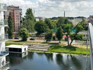 a view of a river in a city with buildings at Maya's Flats & Resorts 34 - Chmielna 73 in Gdańsk