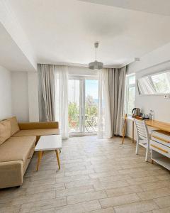 a living room with a couch and a table at Hideaway in Kas