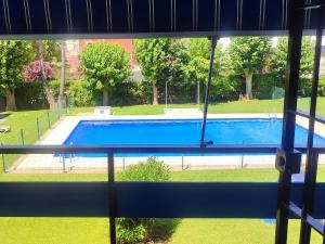 a view of a swimming pool from a window at Estudio LA paradise in Torremolinos