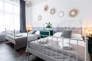 Posteľ alebo postele v izbe v ubytovaní Kazimierz Friendhouse Apartments