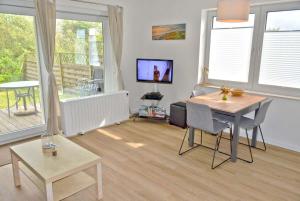 Μια τηλεόραση ή/και κέντρο ψυχαγωγίας στο Haus am Golfplatz Nr 01 Ferienwohnung