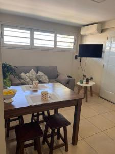 a living room with a table and a couch at Departamento Los Jilgueros in Posadas