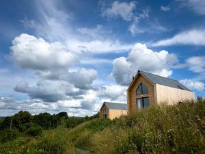 a house sitting on top of a hill at Tarset Tor - Bothy Cabin 5 in Hexham