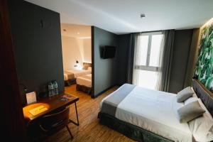 Posteľ alebo postele v izbe v ubytovaní Málaga Premium Hotel