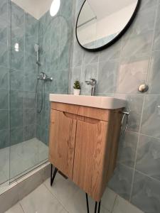 a bathroom with a sink and a shower at Villa Stina in Pisak +51 photos