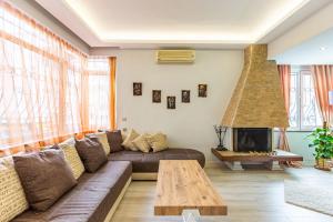 a living room with a couch and a fireplace at Comfy Flat near Trendy Attractions in Sisli in Istanbul