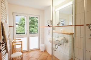 a bathroom with a sink and a mirror at Oberstdorfer Ferienwelt in Oberstdorf