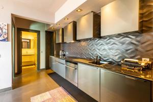 a kitchen with stainless steel cabinets and a sink at Stylish Apartment with Bosphorus View in Besiktas in Istanbul