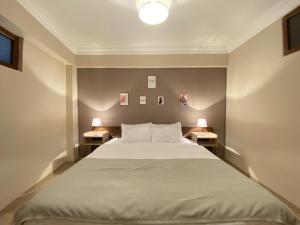 a bedroom with a large bed with two night stands at Distinguished Flat near Pera Museum in Beyoglu in Istanbul