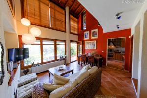 a living room with a couch and a table at Avista Villa in Vourvourou