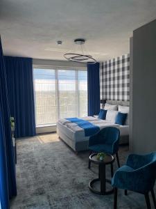 Postel nebo postele na pokoji v ubytování Hotel Sanova