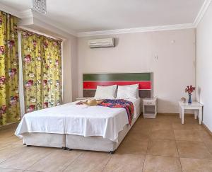 Ein Bett oder Betten in einem Zimmer der Unterkunft Abelia Otel