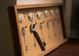 a wooden box with a bunch of keys on it at Le Chalet d'Ouchy in Lausanne