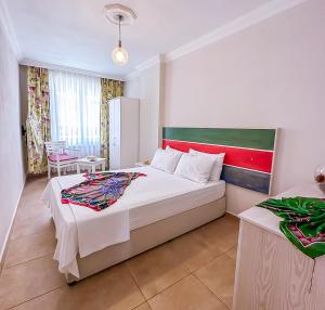Ein Bett oder Betten in einem Zimmer der Unterkunft Abelia Otel