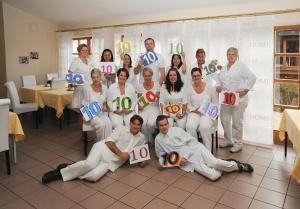 a group of people holding up signs with numbers at Ferien- und Aktivhotel Zum Arber in Bodenmais