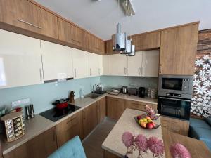 Kuchyň nebo kuchyňský kout v ubytování Jázmin Apartman