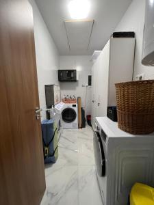 Kuchyň nebo kuchyňský kout v ubytování Jázmin Apartman