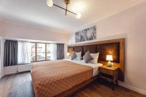 Postel nebo postele na pokoji v ubytování Boutique Hotel Manufactura