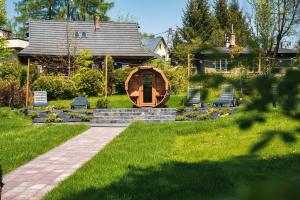 Vonkajšia záhrada v ubytovaní Srebrny Bucznik Wellness & Restaurant