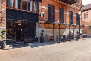 a store front with a black gate on a building at Boutique Hotel Manufactura in Tbilisi City