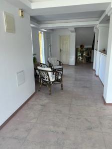 a hallway with chairs and a table in a house at Satmar in Lozenets +41 photos