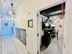 an open door to a room with a desk at New York Spirit Retreats HOSTEL in New York