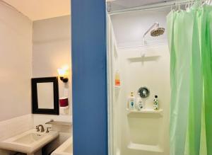 a bathroom with a shower and a sink at New York Spirit Retreats HOSTEL in New York