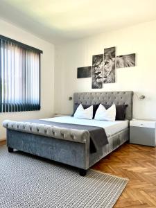a bedroom with a large bed in a room at Super Center in Stara Zagora